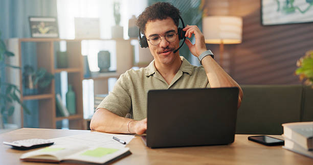 istock Customer service, remote work and man with headset on laptop for support, online help and virtual meeting. Communication, working from home and person for discussion, advice and webinar on computer 2227881167