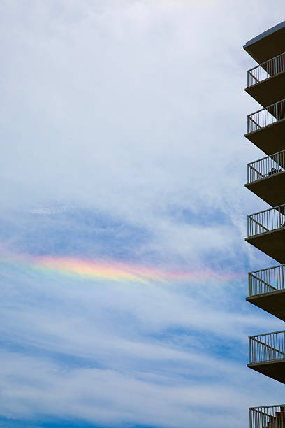 Rainbow in the sky with condominium silhouette. Shot in Gulf Shores, Alabama with a Canon EOS Mark V camera.