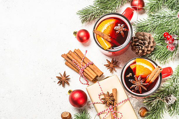 istock Mulled wine in red mugs with christmas decorations. 2227884584