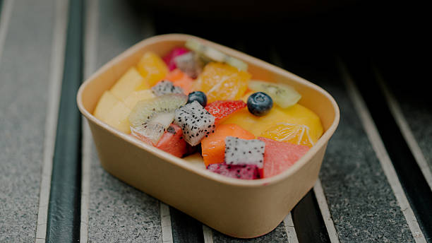 istock Pieces of fruit in plastic box prepared as lunch during an outdoor activity. 2227885696