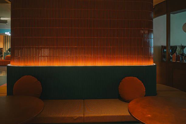 istock Stylish Retro-Inspired Lounge Interior with Warm Lighting 2227886190