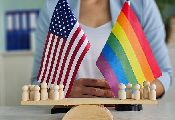 istock Balancing equality and diversity with American and pride flags 2227886500