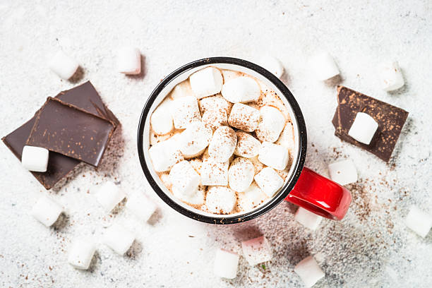 istock Hot chocolate with marshmallow and christmas cookies at white table. 2227887195