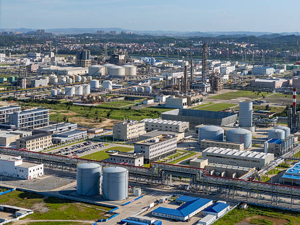 istock Industrial Landscape with Blue Roofed Buildings 2227888326