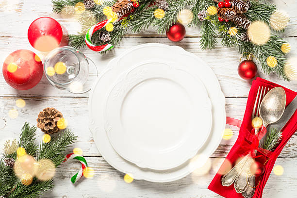 istock Christmas table setting with holidays decorations at white wooden table. 2227889331
