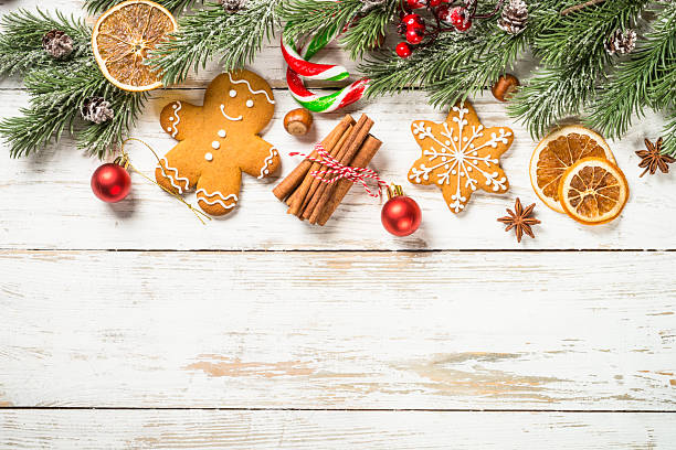 istock Christmas spices with gingerbread cookies at white table with holidays decorations. 2227889717