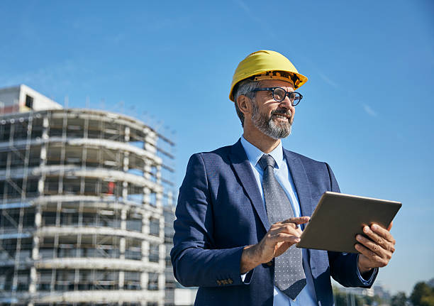 istock businessman construction site business architect building engineer builder tablet helmet architecture blueprint worker man contractor adult engineering industry 2227901346