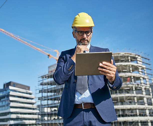 istock businessman construction site business architect building engineer builder tablet helmet architecture blueprint worker man contractor adult engineering industry 2227901484