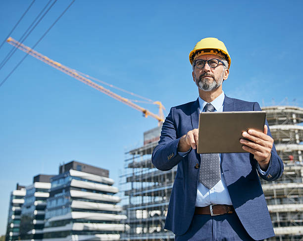 istock businessman construction site business architect building engineer builder tablet helmet architecture blueprint worker man contractor adult engineering industry 2227901611