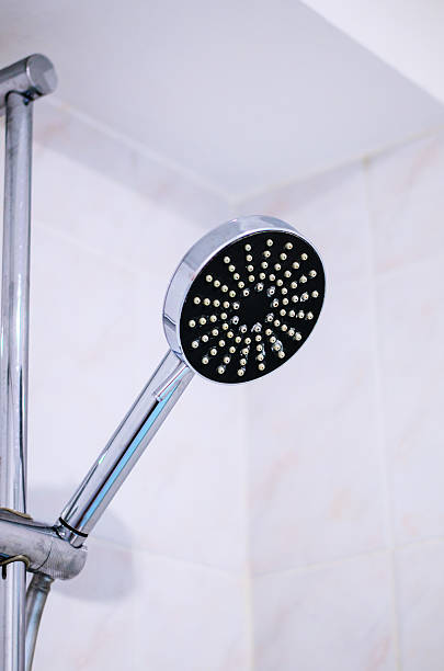 istock Modern chrome shower head with black surface and white nozzles 2227903551