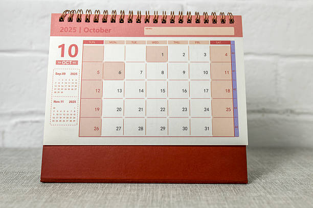 istock October 2025. A desktop calendar for planning on the table. 2227904331