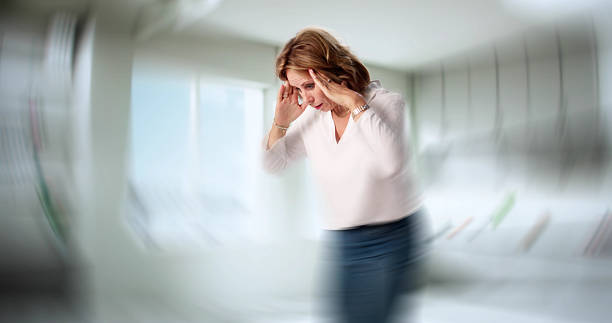 istock Senior Woman Balances Vertigo 2227904719
