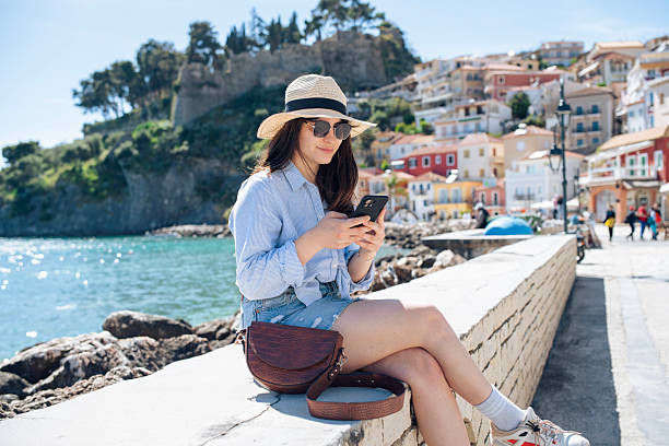 istock Woman on a summer vacation using her smart phone. 2227905624