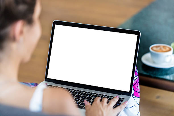 istock Woman using and typing on laptop with blank white Laptop computer screen 2227905687