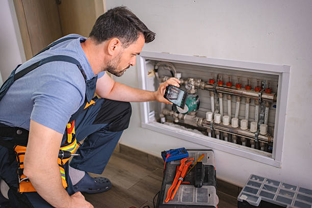 istock Technician taking pictures of heating pipes using smartphone for remote assistance 2227906728