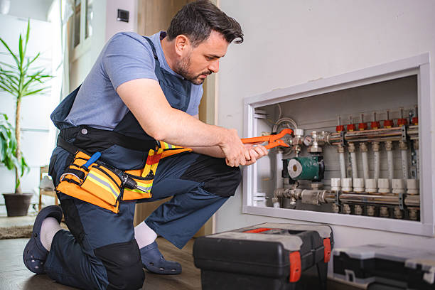 istock Plumber Installing Underfloor Heating Manifold in a Residential Building 2227906776