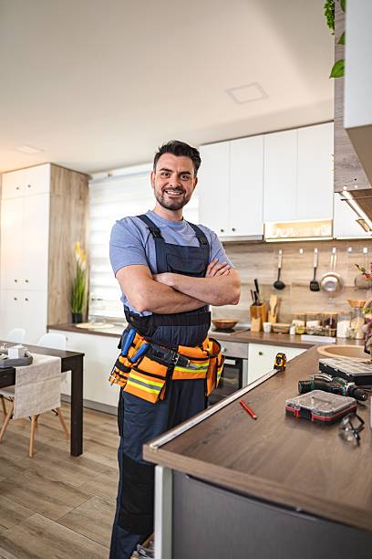 istock Handyman smiling with crossed arms in a modern kitchen 2227906822