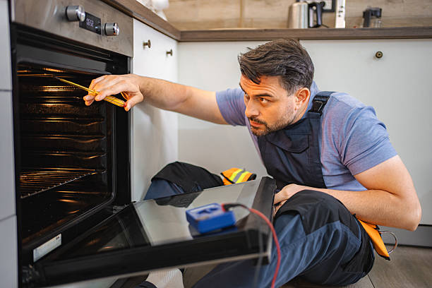 istock Mid Adult Technician Repairing Kitchen Oven 2227906902