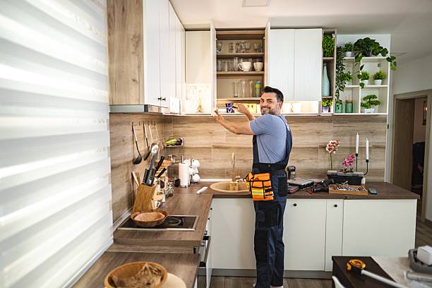 istock Handyman installing led strip lights under kitchen cabinets 2227906914