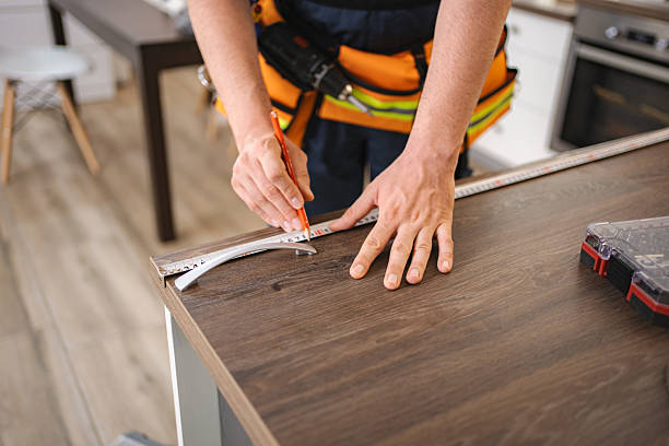 istock Carpenter measuring and marking wooden surface with pencil and ruler 2227906917