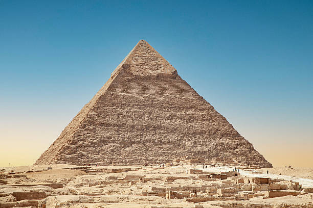 Great Sphinx of Giza, Cairo, Egypt, aligned with piramid. Black anda white, retro style.
