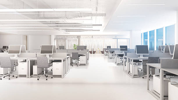 istock Working area in a large office building with desks and corridors, bright white light tone, 3D rendering 2227909435