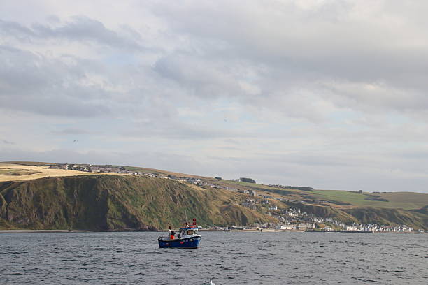 Lobster fishing off village of Pennan, Aberdeenshire, Scotland, taken from a boat on the North Sea
