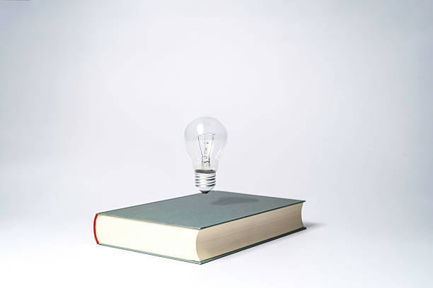 istock a book with a floating light bulb to be smart 2227913610