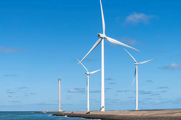 istock Modern wind turbines on the breakwater 2227916641
