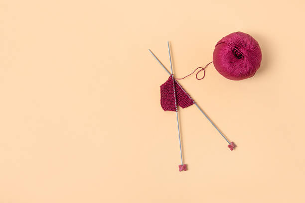 istock Vinous knitted wool and knitting needles 2227919225