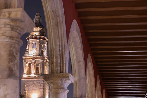 A colonial church illuminated on a rainy night in the historic center of downtown Campeche, Mexico.