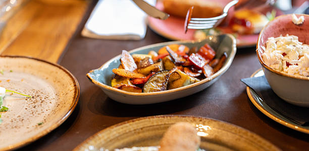 istock Assorted Delicious Dishes Served on a Set Dining Table in a Cozy Setting 2227924305