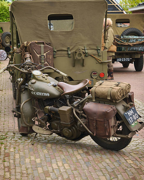 May 5, 2024 - Netherlands: Restored World War II military jeeps and Harley-Davidson Liberator WLA motorcycle on display during a liberation commemoration event in Drenthe province.