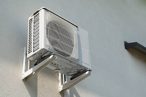 istock Wall-mounted split air conditioning system on exterior wall of residential home cooling indoor environment 2227933480