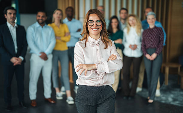 istock Empowered Business Leader Standing with Successful Team 2227936737