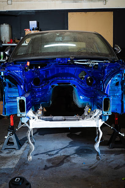 Project drift car in a raw phase before installing suspension, massive tires, and clean detailing work. Drift Car Chassis Build - Custom Painted and Stripped Drift Project in Progress.