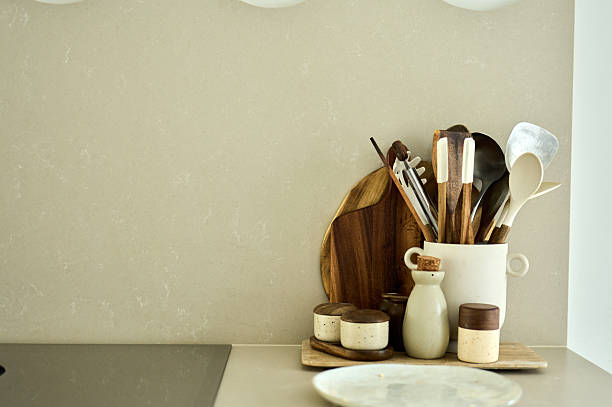 istock Kitchen utensils and condiment holders neatly arranged on countertop 2227938081