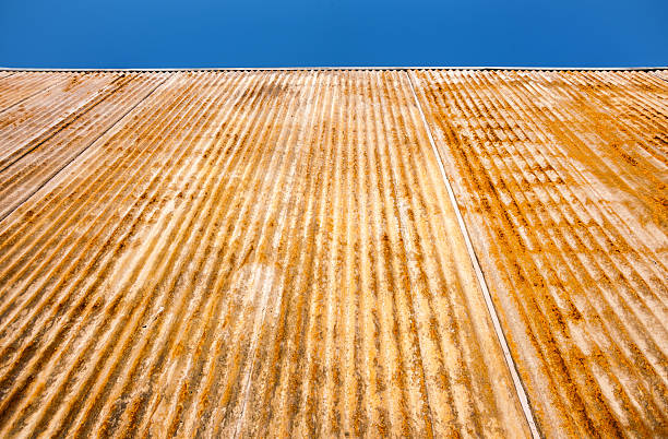 istock Rusted corrugated wall leads to endless blue sky 2227938784