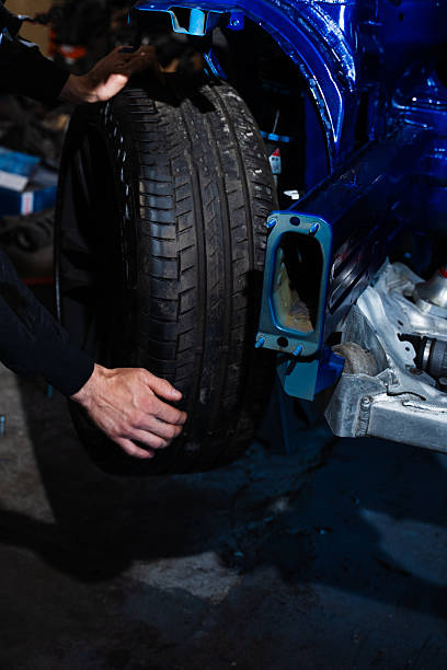 istock Performance wheel install on tuned suspension with visible brake system. Drift Car Wheel and Tire Mounting. Performance wheel install on tuned suspension with visible brake system. 2227939418