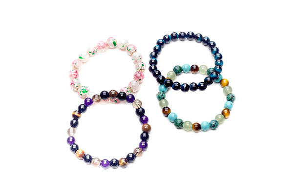 istock Four different bracelets close-up on white background 2227939544