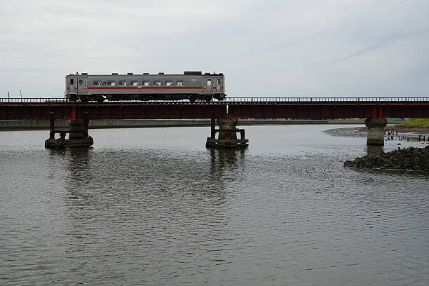 Kushiro-city, Hokkaido, Japan - July 26, 2025 : KIHA 54 Local train that crosses the Kushiro River