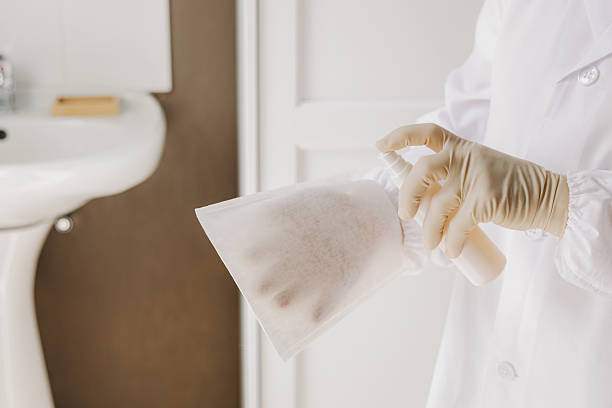 istock A nurse soaks a disposable textile glove with medicine. 2227946797
