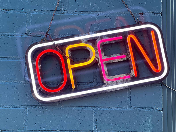 Colourful neon open sign on a small business