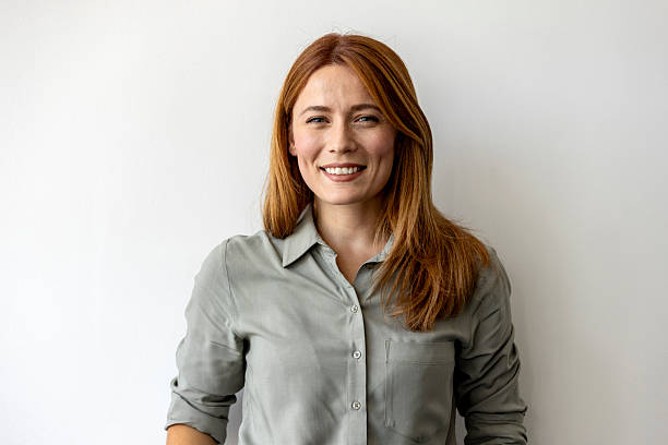 istock Confident Professional Woman Smiling Against Plain Background 2227947872
