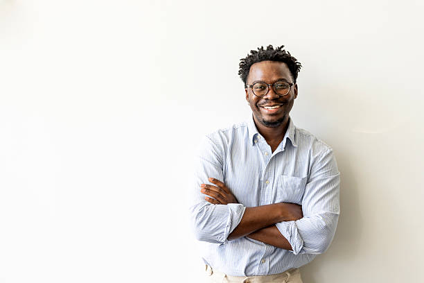 istock Confident Man Smiling in Casual Shirt Against White Background 2227947889