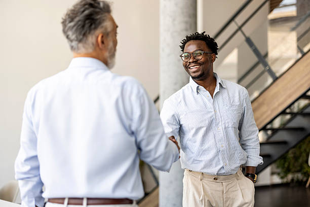 istock Two Businessmen Shaking Hands in a Modern Office 2227949409
