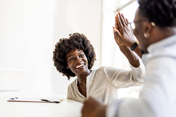 istock Joyful Colleagues Celebrating Success with a High Five 2227949422