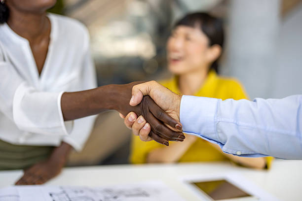 istock Diverse Professionals Shaking Hands in Business Meeting 2227949478