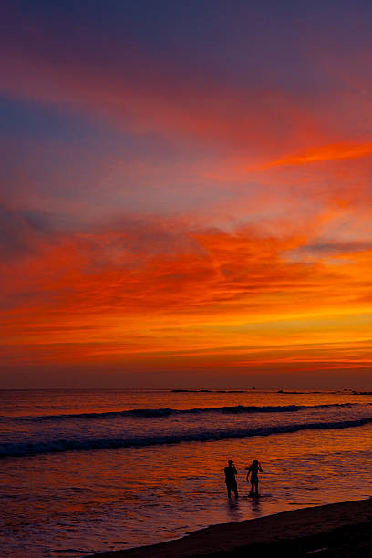 istock Couple enjoying a beautiful sunset 2227955783