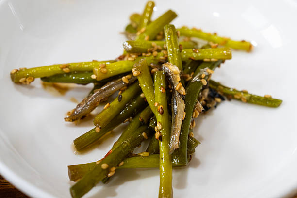 istock stir-fried anchovy and garlic stem 2227956509